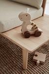 KID'S CONCEPT Agarre con ruedas Dino natural | 7340028730477 | Llibreria Sendak